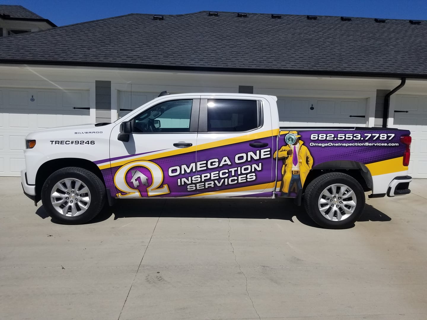 Omega One Inspection Services work truck at residential property